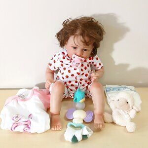 Realistic baby doll (Lucy) with accessories